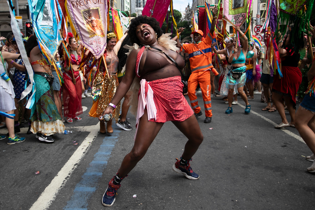 A reveler dances during the "Cordao do Boitata" street pre-carnival party in Rio de Janeiro, Sunday, Feb. 8, 2026. (AP Photo/Bruna Prado)
