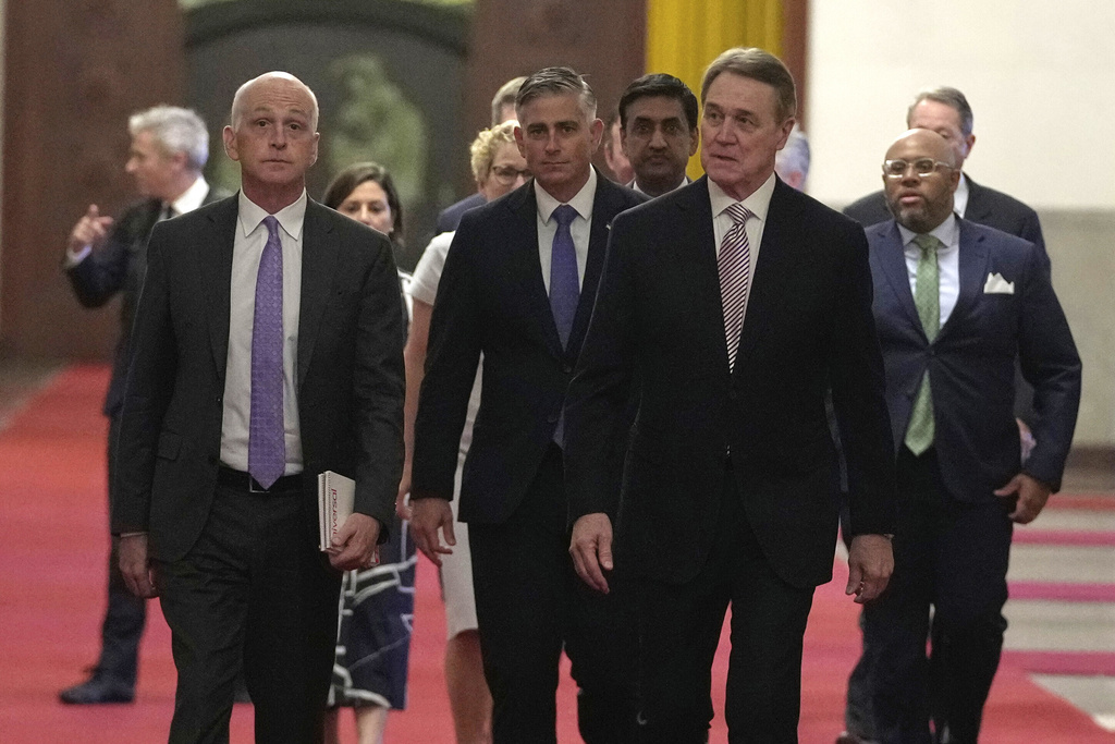 Rep. Adam Smith, D-Wash, left, leads a bipartisan group of U.S. lawmakers including from left Chrissy Houlahan, Democratic member of House Armed Services Committee, Michael Baumgartner, Republican member of House Foreign Affairs Committee, Ro Khanna, Democratic member of House Armed Services Committee and David Perdue, US Ambassador to China for a meeting with Chinese Premier Li Qiang at the Great Hall of the People in Beijing, China, Sunday, Sept. 21, 2025. (AP Photo/Mahesh Kumar A., Pool)