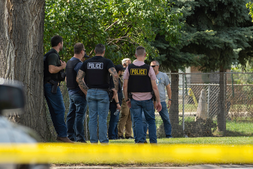 FILE - Law enforcement personnel investigate after the Department of Homeland Security said an Immigration and Customs Enforcement agent fatally shot a man in the Franklin Park suburb of Chicago on Sept. 12, 2025. (Candace Dane Chambers/Chicago Sun-Times via AP, File)