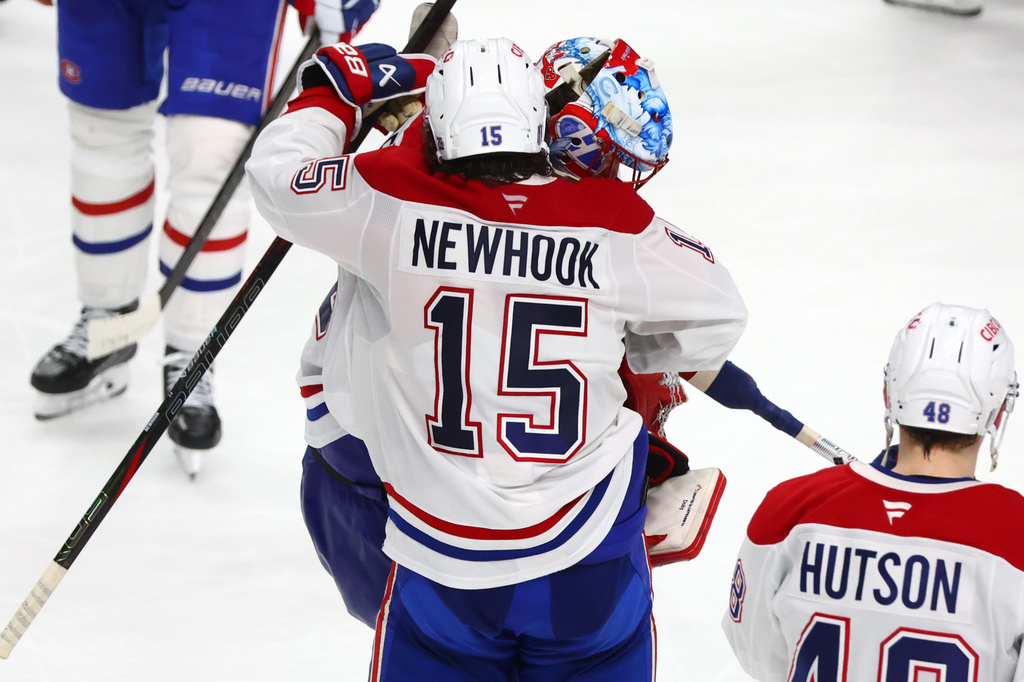 Montreal Canadiens players celebrate following the overtime period in Game 7 of a second-round NHL hockey Stanley Cup playoff series against the Buffalo Sabres, Monday, May 18, 2026, in Buffalo, N.Y. (AP Photo/Jeffrey T. Barnes)