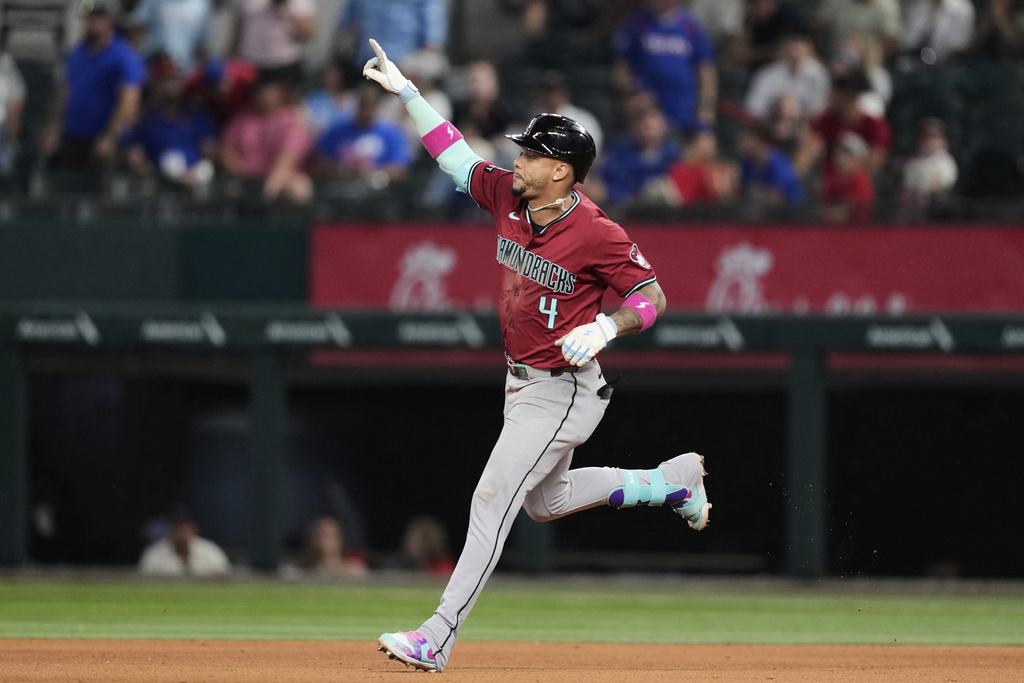 Arizona Diamondbacks' Ketel Marte celebrates his three-run home run in the ninth inning of a baseball game against the Texas Rangers Wednesday, Aug. 13, 2025, in Arlington, Texas. (AP Photo/Tony Gutierrez)