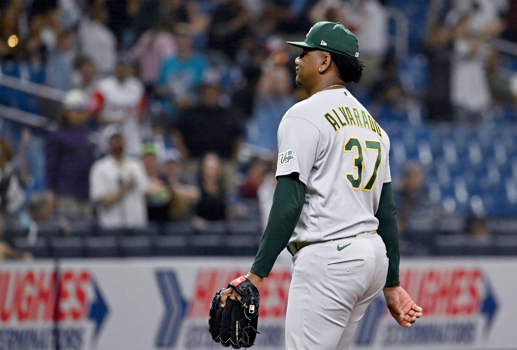 Athletics pitcher Elvis Alvarado walks off the field after giving up a a walk-off home run to Tampa Bay Rays' Junior Caminero during the ninth inning of a baseball game Tuesday, Sept. 15, 2026, in St. Petersburg, Fla. (AP Photo/Jason Behnken)