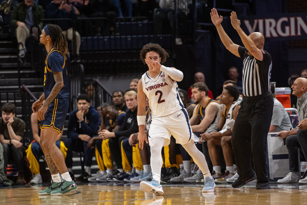 Virginia guard Chance Mallory (2) celebrates after hitting a three pointer against California during the first half of an NCAA college basketball game, Wednesday, Jan. 7, 2026, in Charlottesville, Va. (AP Photo/Robert Simmons)