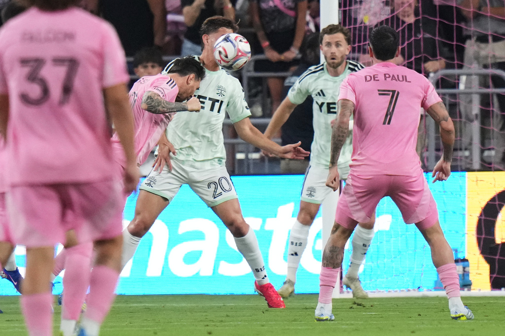 Inter Miami CF forward Lionel Messi, left scores a goal during the first half of an MLS soccer match against Austin FC, Saturday, April 4, 2026, in Miami. (AP Photo/Lynne Sladky)