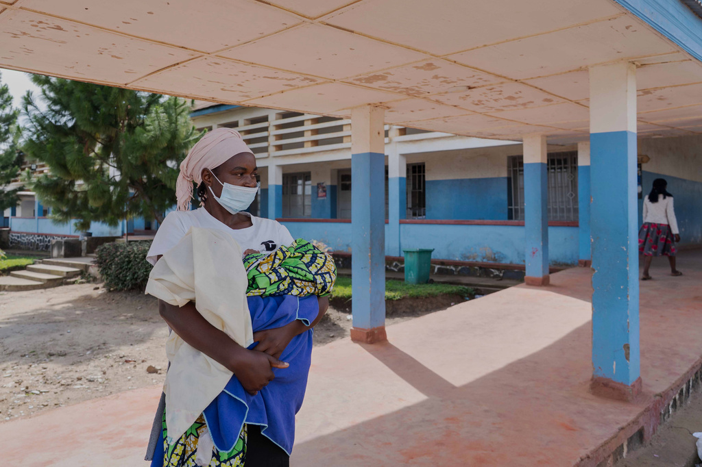 A woman wearing a protective mask stands in the corridor of a hospital in Bunia, Congo, Sunday, May 17, 2026. (AP Photo/ Dirole Lotsima Dieudonne)