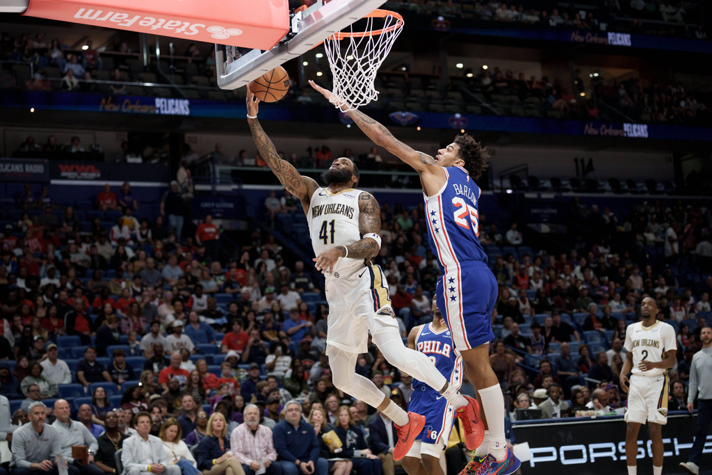 New Orleans Pelicans guard Saddiq Bey (41) shoots against Philadelphia 76ers forward Dominick Barlow (25) during the first half of an NBA basketball game in New Orleans, Saturday, Feb. 21, 2026. (AP Photo/Matthew Hinton)