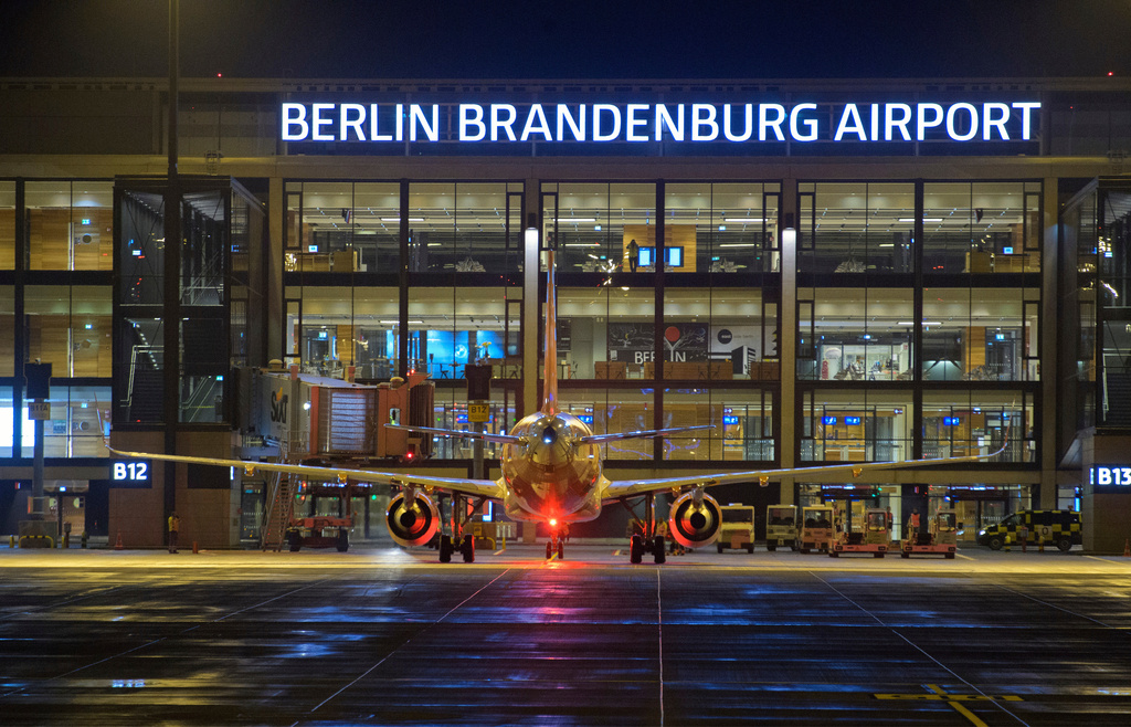 FILE- An easyJet airplane will be handled at Terminal 1 in the evening after the opening of the new Berlin Brandenburg "Willy Brandt" (BER) Airport, Saturday, Oct. 31, 2020, in Berlin, Germany. (Soeren Stache/dpa via AP, File)