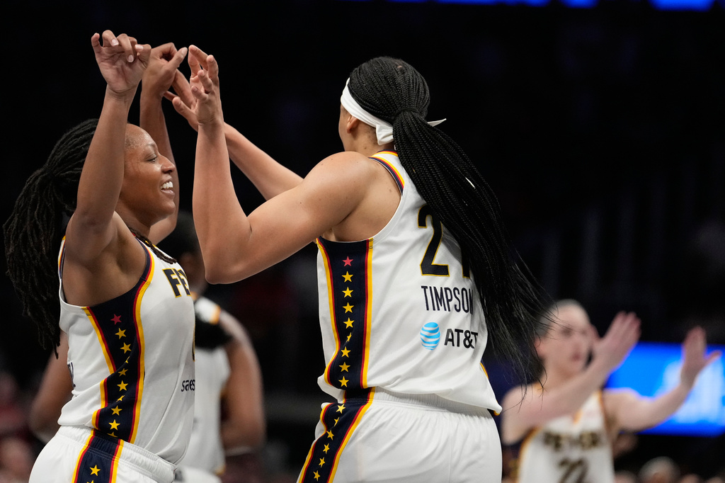 Indiana Fever forward Makayla Timpson (21) celebrates with Indiana Fever center Aliyah Boston (7) in the overtime during an WNBA basketball game against the Sunday, Aug. 16, 2026, in Atlanta. (AP Photo/Brynn Anderson)