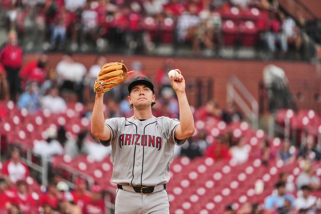 Arizona Diamondbacks starting pitcher Mitch Bratt pauses between pitches during the first inning of a baseball game against the St. Louis Cardinals Wednesday, June 24, 2026, in St. Louis. (AP Photo/Jeff Roberson)