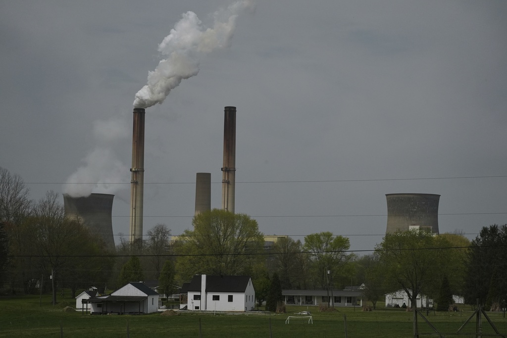 FILE - A home sits near the Gen. James Gavin Power Plant, a coal-fired power plant, April 14, 2025, in Point Pleasant, W.Va. (AP Photo/Joshua A. Bickel, File)