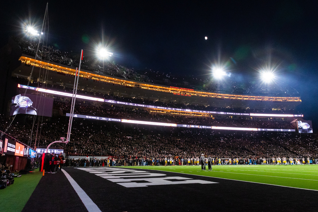 Fans wear black at Memorial Stadium during the first half of an NCAA college football game between Nebraska and Southern California, Saturday, Nov. 1, 2025, in Lincoln, Neb. (AP Photo/Bonnie Ryan)