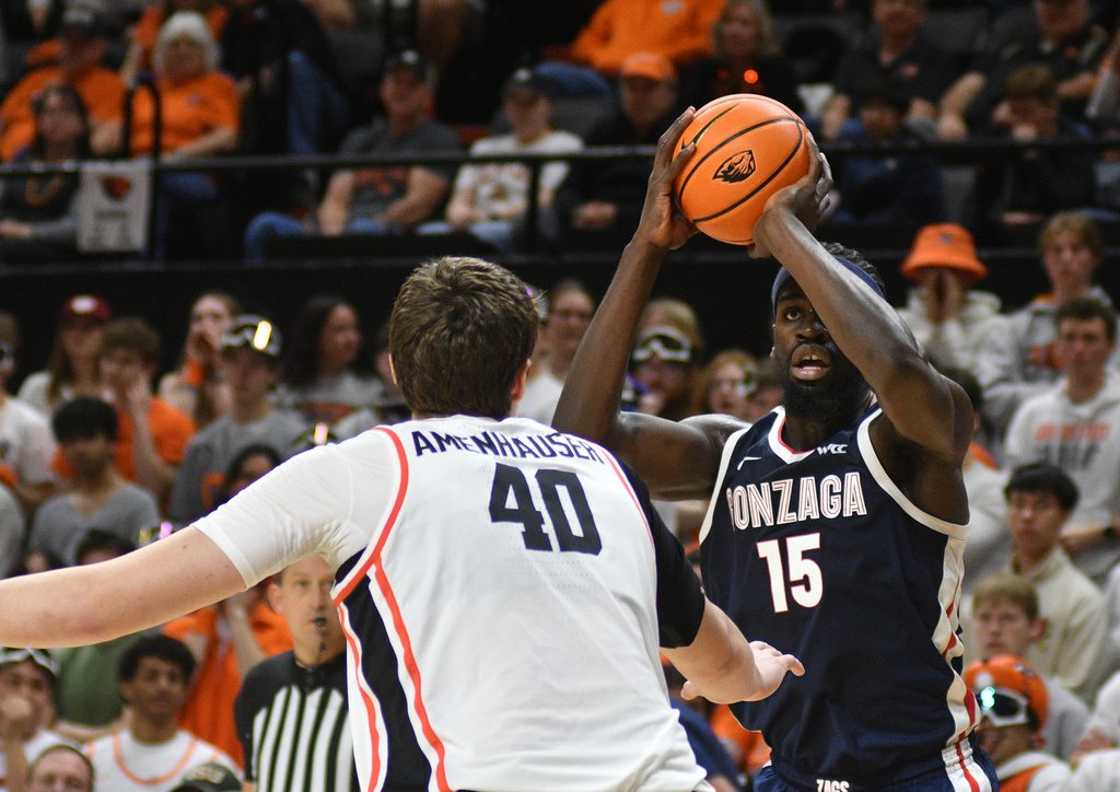 Gonzaga forward Graham Ike (15) shoots over Oregon State center Noah Amenhauser (40) during an NCAA college basketball game Saturday, Feb. 7, 2026, in Corvallis, Ore. (AP Photo/Mark Ylen)