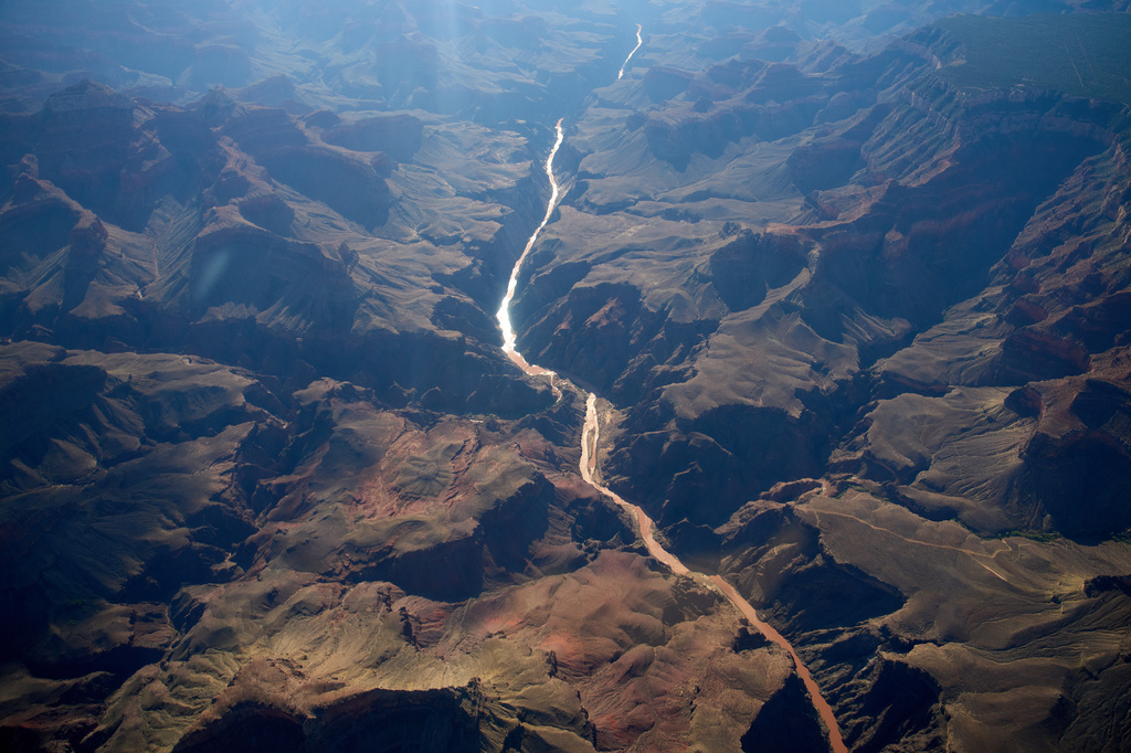 Bright Angel Canyon, middle left, the scene of flash floods, meets with the Colorado River in the Grand Canyon, Monday, Aug. 31, 2026, at Grand Canyon National Park, Ariz. (AP Photo/John Locher)