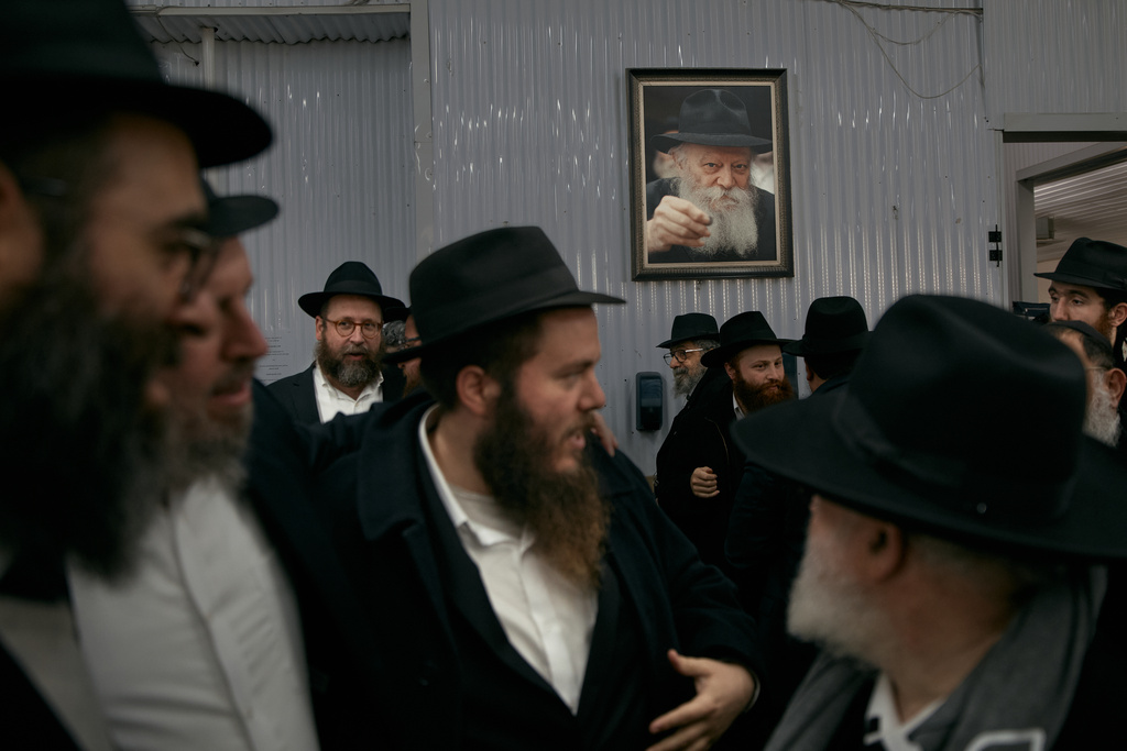 Chabad-Lubavitch rabbis gather at the resting place of the Rebbe, Rabbi Menachem M. Schneerson, one of Judaism’s most influential figures, in the Queens borough of New York on Friday, Nov. 14, 2025, during the International Conference of Chabad-Lubavitch Emissaries. (AP Photo/Andres Kudacki)