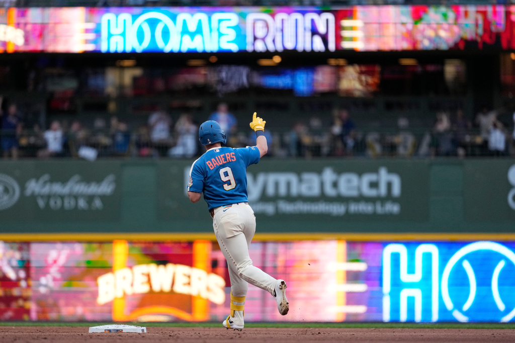 Milwaukee Brewers' Jake Bauers rounds the bases after hitting a three-run home run during the fifth inning of a baseball game against the Philadelphia Phillies, Friday, June 12, 2026, in Milwaukee. (AP Photo/Aaron Gash)