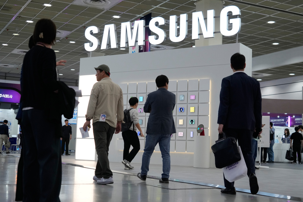 FILE - Visitors pass by the Samsung Electronics' booth during the Korea Electronics Show 2026 in Seoul, South Korea, Friday, Oct. 16, 2026. (AP Photo/Ahn Young-joon, File)