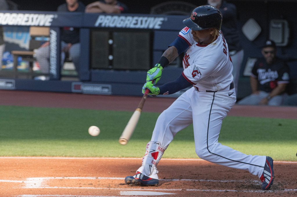 After coming off injured reserve today, Cleveland Guardians' Jose Ramirez hits a single off Minnesota Twins starting pitcher Bailey Ober during the first inning of a baseball game, Wednesday, July 22, 2026, in Cleveland. (AP Photo/Phil Long)