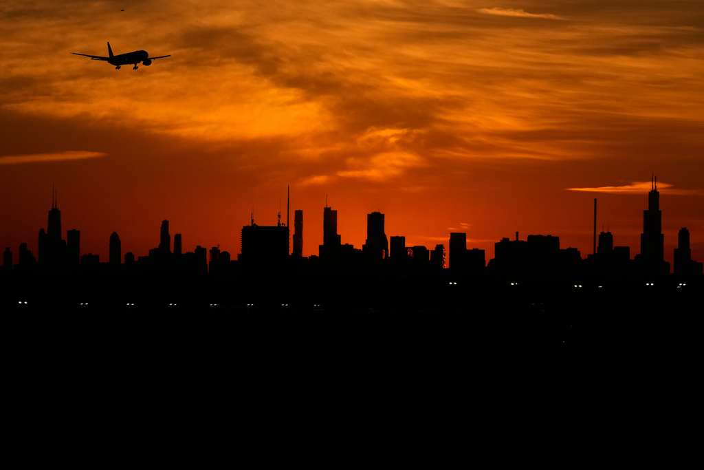 FILE - An airplane descends to land at O'Hare International Airport in Chicago, Wednesday, Nov. 12, 2025. (AP Photo/Nam Y. Huh,File)