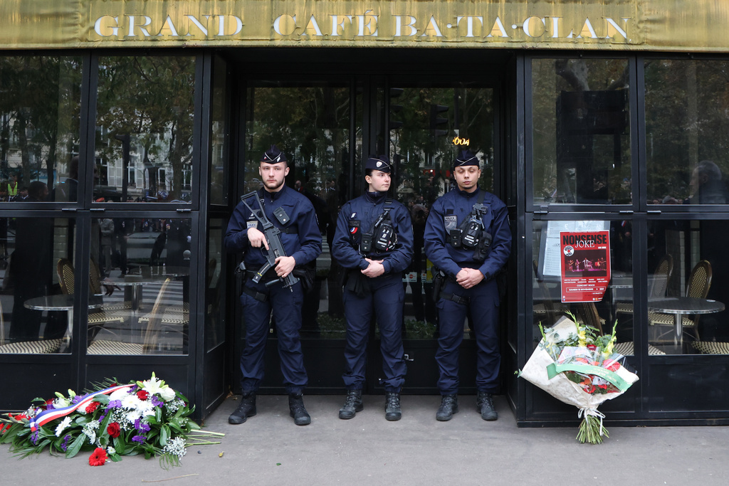 Police officers stand guard near the Bataclan concert hall, Thursday Nov. 13, 2025 in Paris as part of ceremonies marking the 10th anniversary of terrorist attacks that killed 132 people and injured hundreds. (Ludovic Marin, Pool photo via AP)