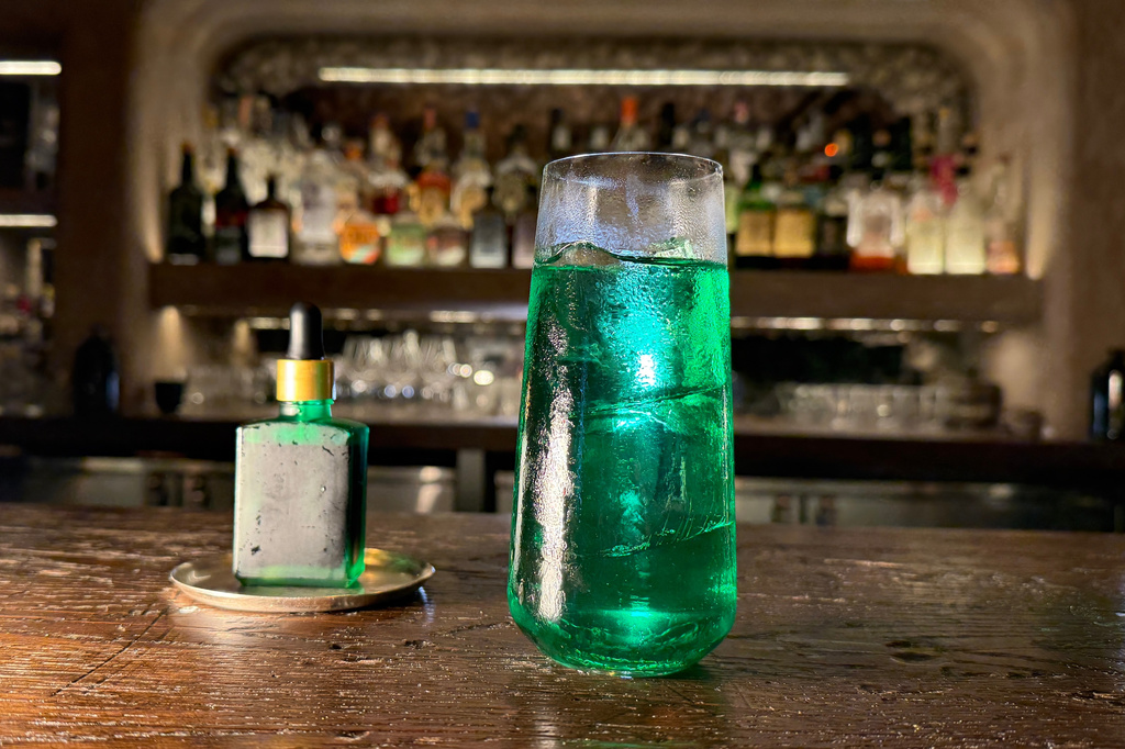 A spicy cocktail called Green Doctor, made with tomatillo, green apple, shiso, and horseradish, is displayed in New York on June 23, 2026. (AP Photo/Guido Neira)