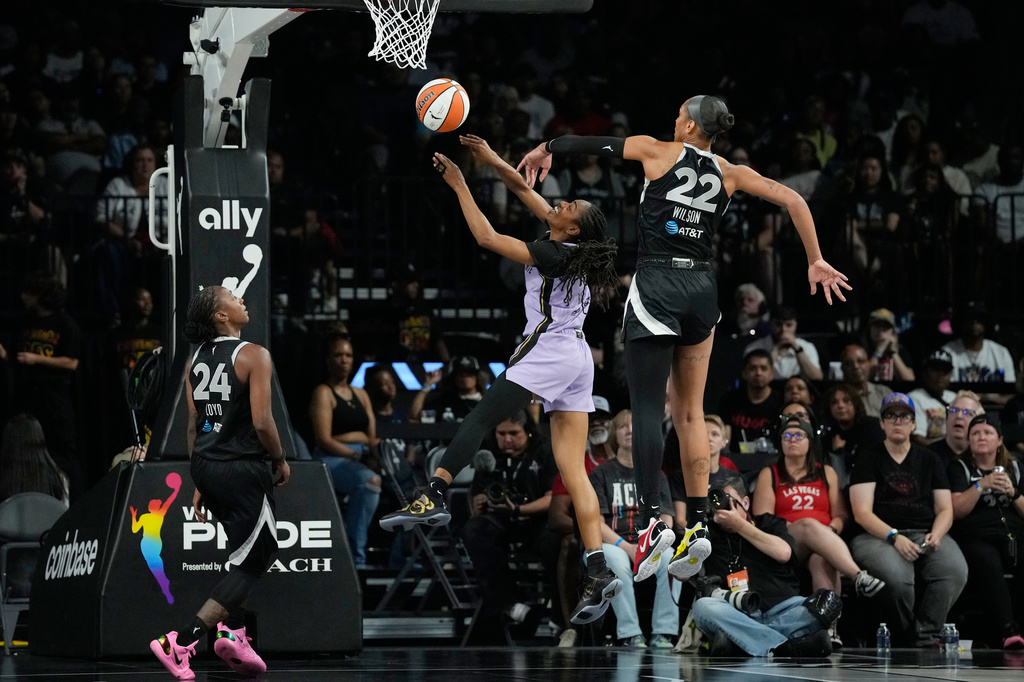 Las Vegas Aces center A'ja Wilson (22) blocks a shot by Golden State Valkyries guard Tiffany Hayes (15) during the second half of a WNBA basketball game Sunday, June 21, 2026, in Las Vegas. (AP Photo/John Locher)