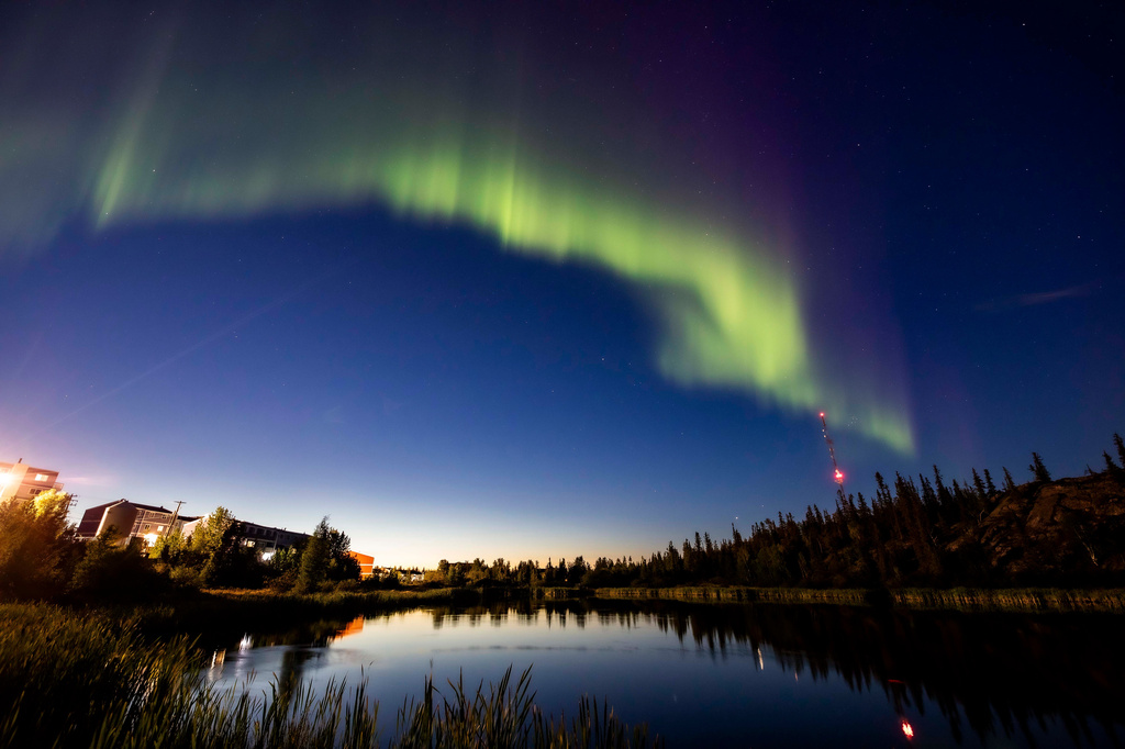 FILE - The northern lights, or the aurora borealis, appear in the sky over Rat Lake in Yellowknife, Northwest Territories on Aug.8, 2024. (Bill Braden/The Canadian Press via AP, File)