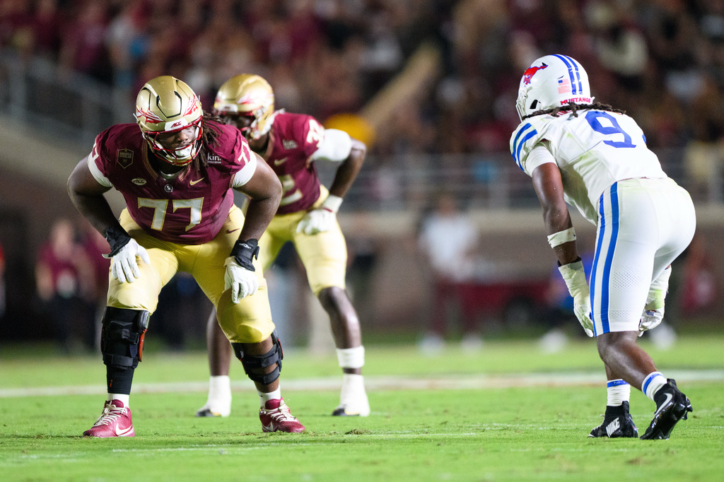 Florida State offensive lineman Xavier Chaplin (77) lines up against SMU defensive end Ira Singleton IV (9) during the first half of an NCAA college football game Monday, Sept. 7, 2026, in Tallahassee, Fla. (AP Photo/Noah Lantor)