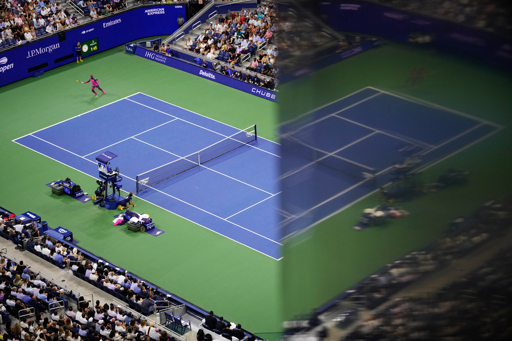 Frances Tiafoe, of the United States, returns the ball to Ben Shelton, of the United States, during the men's singles semifinals of the U.S. Open tennis championships Friday, Sept. 11, 2026, in New York. (AP Photo/Yuki Iwamura)