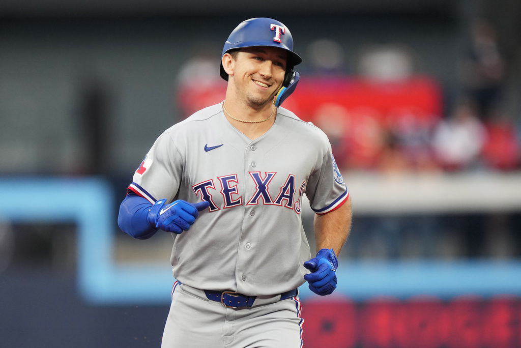 Texas Rangers' Wyatt Langford (36) rounds the bases after hitting a three-run home run against the Toronto Blue Jays during the third inning of a baseball game in Toronto, Thursday, June 25, 2026. (Nathan Denette/The Canadian Press via AP)