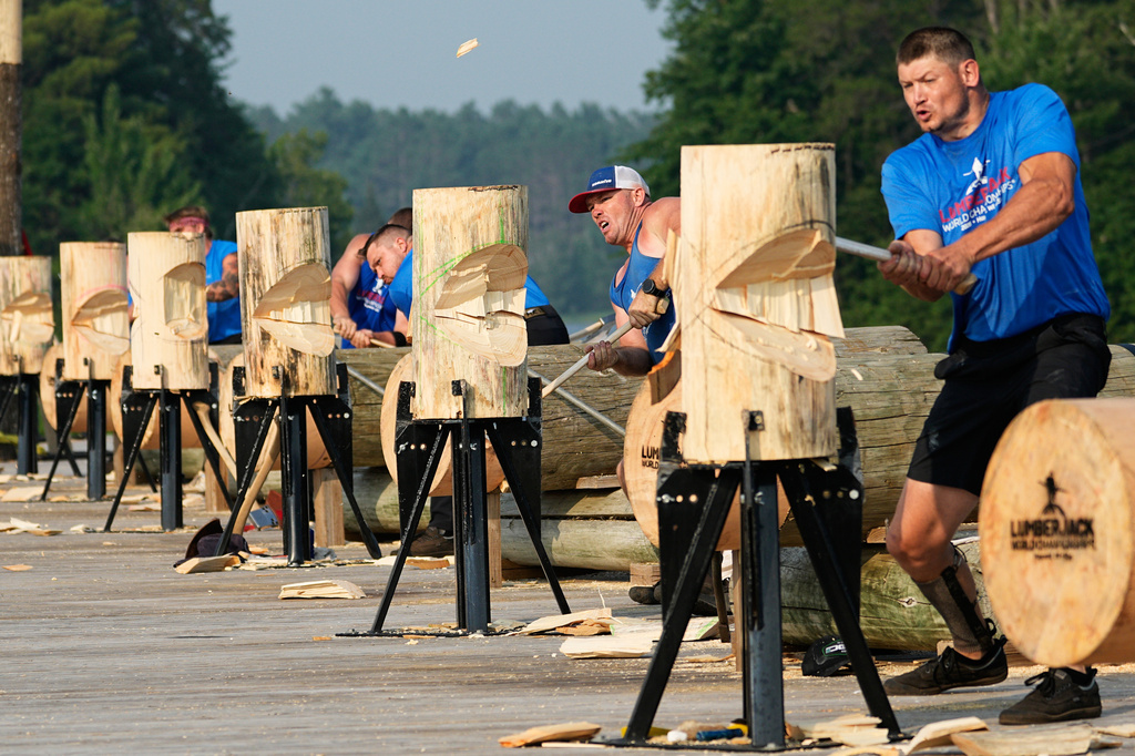 Athletes compete in the men's standing chop during the Lumberjack World Championships, Saturday, July 18, 2026, in Hayward, Wis. (AP Photo/Ellen Schmidt)