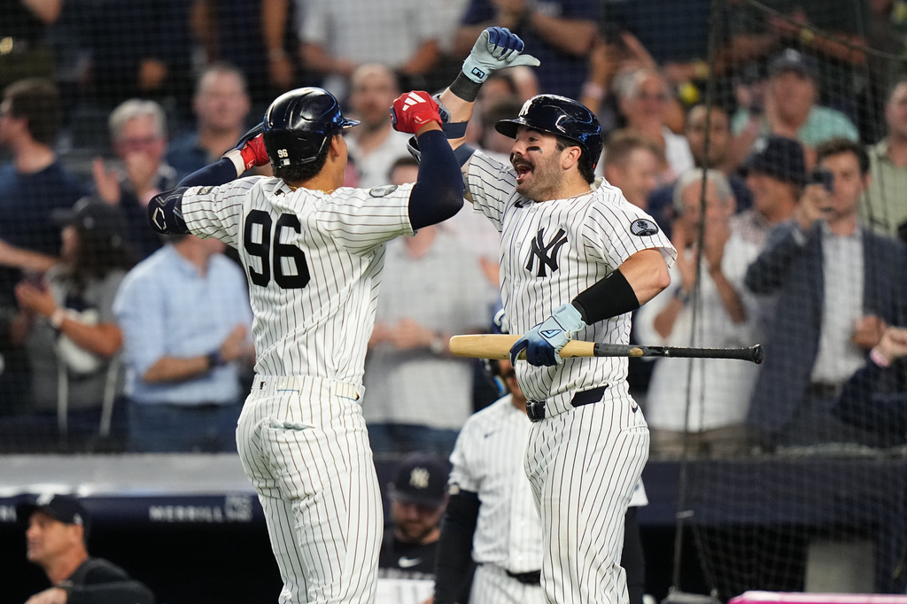 New York Yankees' Austin Wells, right, celebrates with George Lombard Jr. Lombard's home run during the fifth inning of a baseball game against the St. Louis Cardinals Tuesday, Aug. 4, 2026, in New York. (AP Photo/Frank Franklin II)