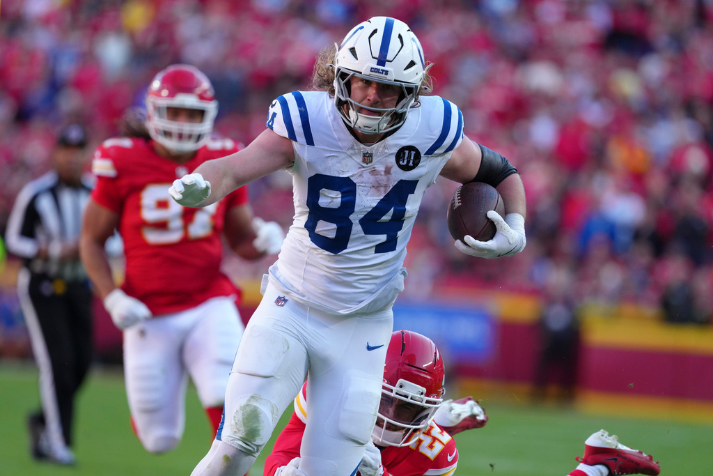 Indianapolis Colts tight end Tyler Warren (84) is tackled by Kansas City Chiefs cornerback Trent McDuffie (22) after a catch during the second half of an NFL football game Sunday, Nov. 23, 2025, in Kansas City, Mo. (AP Photo/Ed Zurga)