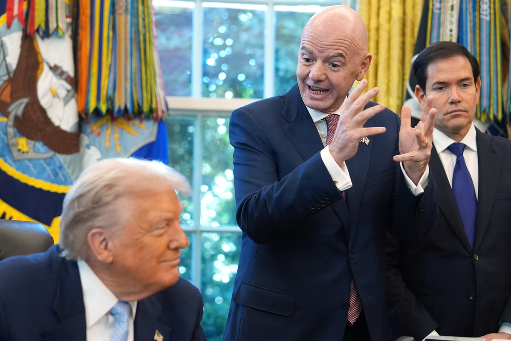 President Donald Trump and Secretary of State Marco Rubio listen as FIFA President Gianni Infantino speaks during a meeting with the White House task force on the 2026 FIFA World Cup in the Oval Office of the White House, Monday, Nov. 17, 2025, in Washington. (AP Photo/Evan Vucci)