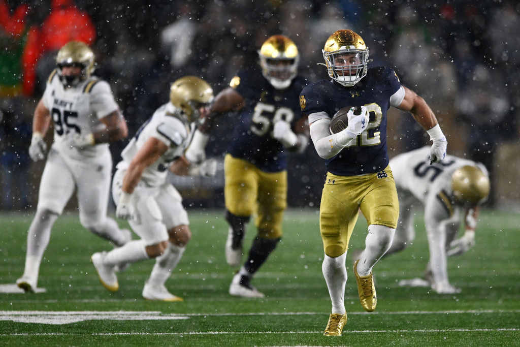 Notre Dame running back Aneyas Williams (22) rushes for a touchdown during the fourth quarter of an NCAA football game against Navy, Saturday, Nov. 8, 2025, in South Bend, Ind. (AP Photo/Paul Beaty)