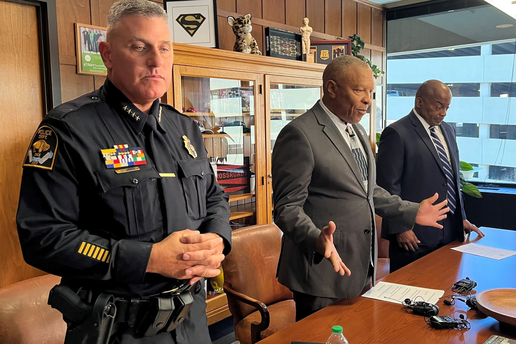 From left, Omaha, Neb., Police Chief Todd Schmaderer, Mayor John Ewing and Ewing's chief of staff, Tom Warren, hold a news conference Friday, Oct. 3, 2025, to address the traffic stop of champion boxer Terence Crawford, who was pulled from his car by police at gunpoint just hours after the city held a parade and celebration in this honor. (AP Photo/Margery Beck)