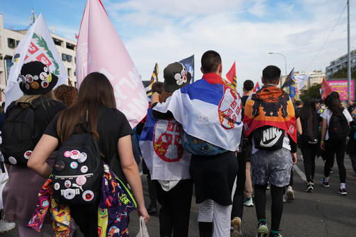 People gather, among them students, to walk on the street towards the northern city of Novi Sad, for a huge rally on Nov. 1 marking the first anniversary of a train station disaster that killed 16 people, in Belgrade, Serbia, Thursday, Oct. 30, 2025. (AP Photo/Darko Vojinovic) People gather, among them students, to walk on the street towards the northern city of Novi Sad, for a huge rally on Nov. 1 marking the first anniversary of a train station disaster that killed 16 people, in Belgrade, Serbia, Thursday, Oct. 30, 2025. (AP Photo/Darko Vojinovic)