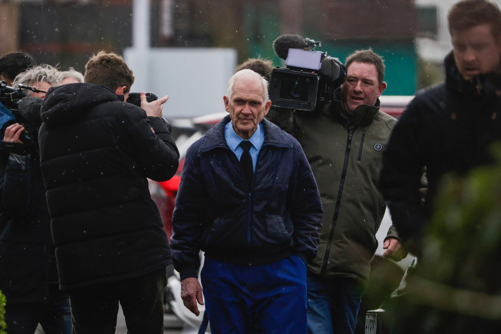 Gloriavale's Howard Temple, center, arrives to the Greymouth District Court in Greymouth, New Zealand, on Aug. 2, 2023. (Jason Blair/The Press/STUFF via AP)