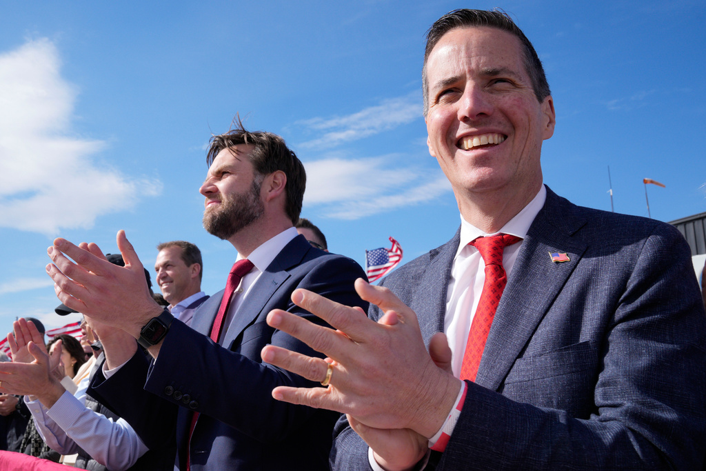 FILE - Sen. J.D. Vance, center, and Senate candidate Bernie Moreno, right, applaud as Republican presidential candidate and former President Donald Trump speaks at a campaign rally in Vandalia, Ohio, March 16, 2024. (AP Photo/Jeff Dean, File)
