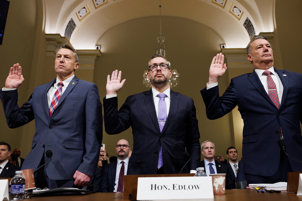 From left, Rodney Scott, commissioner of U.S. Customs and Border Protection, Joseph Edlow, director of U.S. Citizenship and Immigration Services and Todd Lyons, acting director of the U.S. Immigration and Customs Enforcement, are sworn in during a House Committee on Homeland Security oversight hearing of the Department of Homeland Security: ICE CBP and USCIS, on Capitol Hill, Tuesday, Feb. 10, 2026, in Washington. (AP Photo/Tom Brenner)