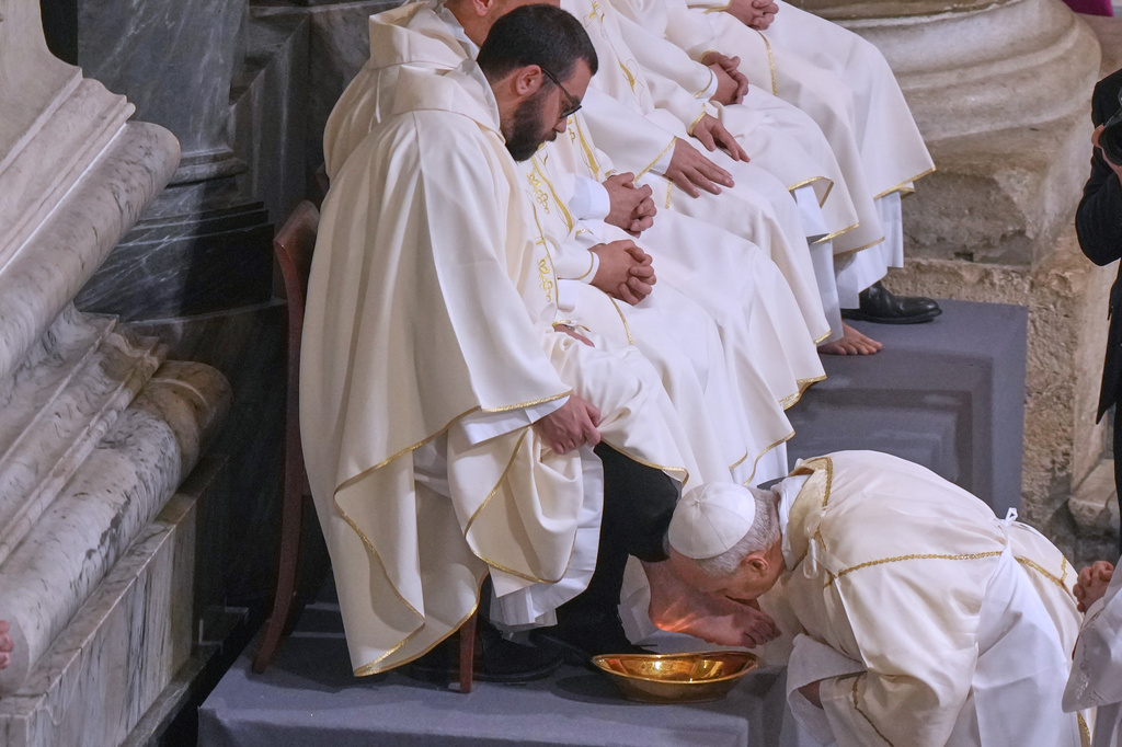 FILE - Pope Leo XIV washes and kisses the feet of 12 Roman priests during the Missa in Caena Domini, the Mass of the Lord's Supper, on Catholic Holy Thursday in St. John Lateran Basilica in Rome, Thursday, April 2, 2026. (AP Photo/Andrew Medichini, File)