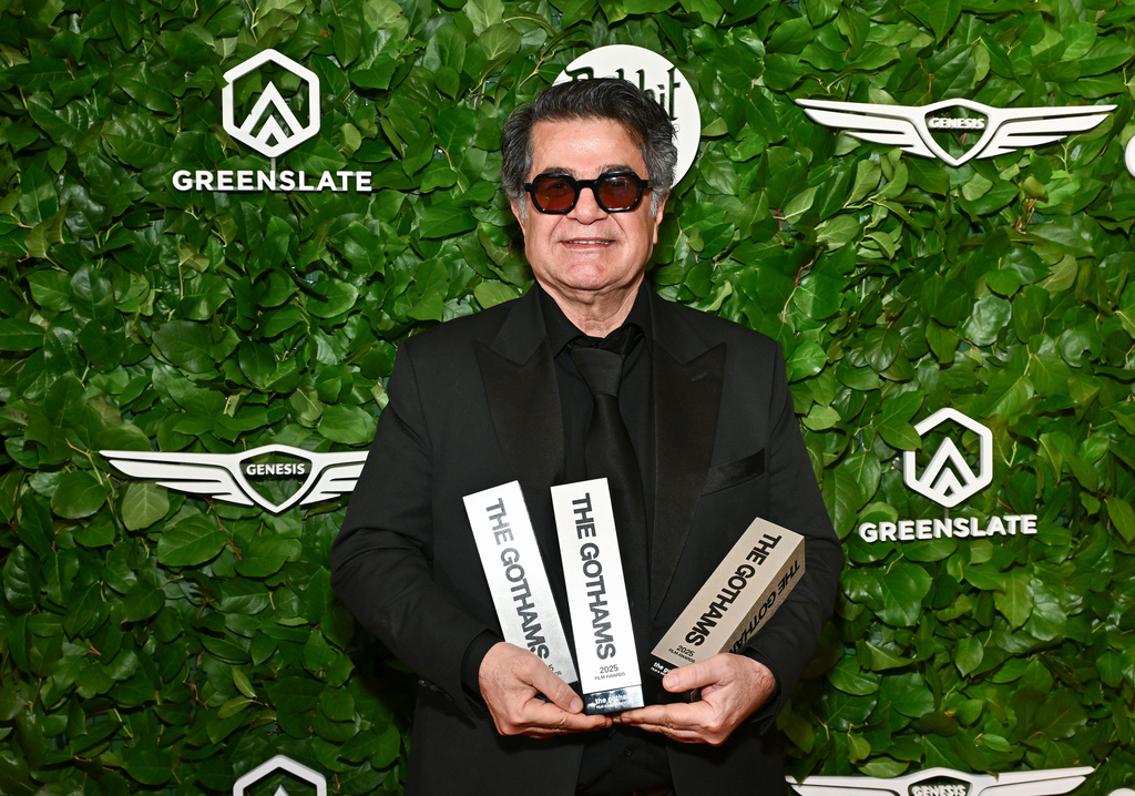 Jafar Panahi poses with the awards for best international feature, best original screenplay and best director at The Gotham Film Awards at Cipriani Wall Street on Monday, Dec. 1, 2025, in New York. (Photo by Evan Agostini/Invision/AP)