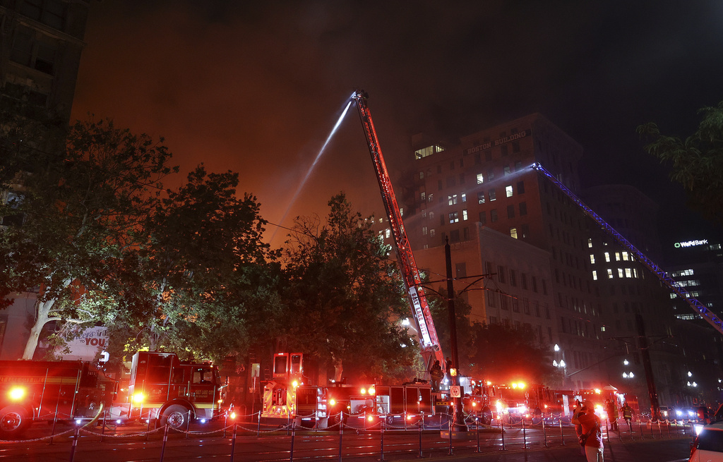 Firefighters battle a structure fire on the 300 South block of Main Street in downtown Salt Lake City on Monday, Aug. 11, 2025. (Kristin Murphy /The Deseret News via AP)