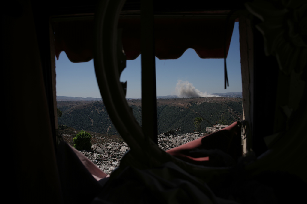 Smoke rises following an explosion in an Israeli-occupied area, as seen from Zawtar al-Gharbieh, southern Lebanon, Tuesday, July 28, 2026. (AP Photo/Hassan Ammar)