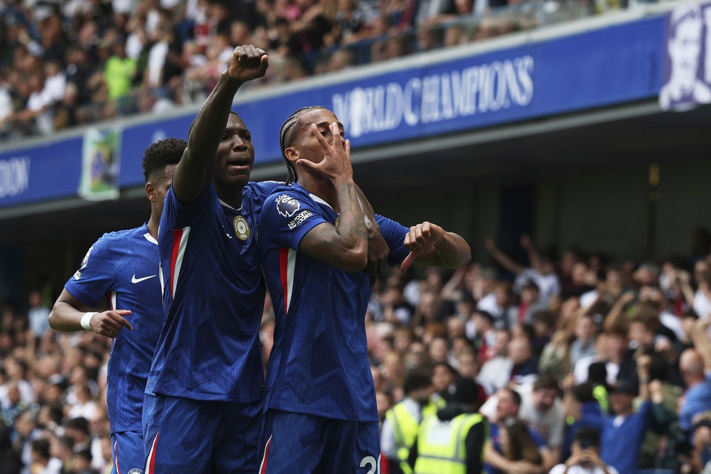 Chelsea's Joao Pedro, right, celebrates with teammates after scoring the opening goal during the English Premier League soccer match between Chelsea and Fulham at Stamford Bridge stadium in London, Saturday, Aug 30, 2025. (AP Photo/Ian Walton)