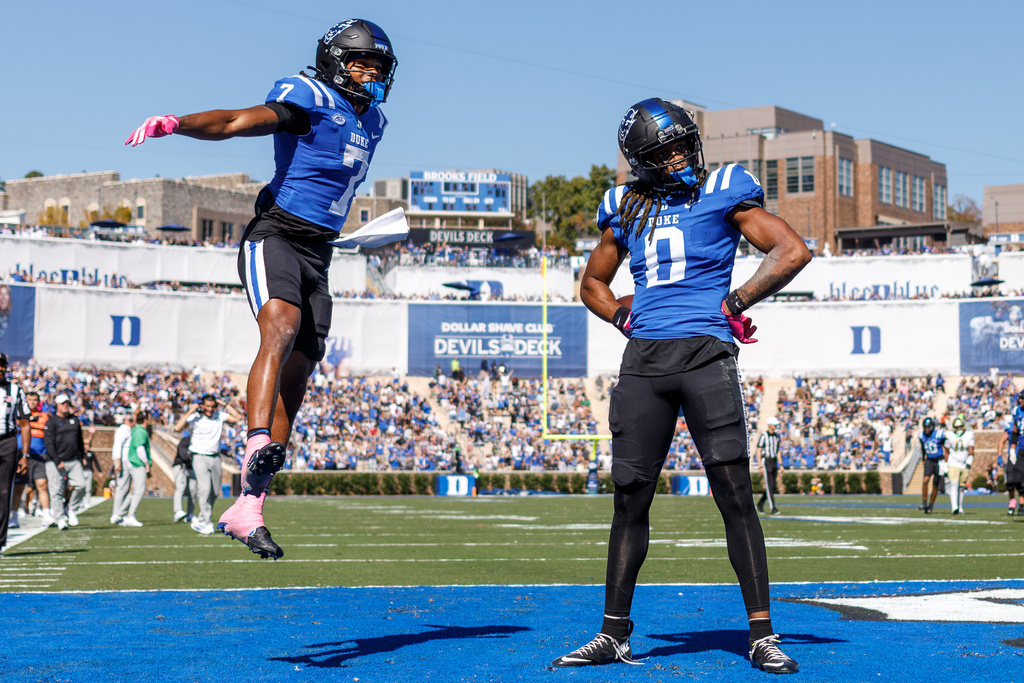 Duke's Landen King (0) celebrates with Que'Sean Brown (7) after scoring a touchdown against Georgia Tech during an NCAA college football game in Durham, N.C., Saturday, Oct. 18, 2025. (AP Photo/Ben McKeown)