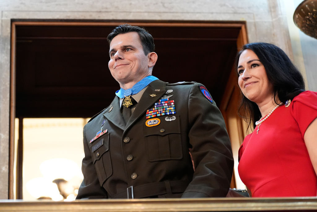 U.S. Army Chief Warrant Officer Eric Slover receives a Medal of Honor during President Donald Trump's State of the Union address to a joint session of Congress in the House chamber at the U.S. Capitol in Washington, Tuesday, Feb. 24, 2026. (AP Photo/Alex Brandon)