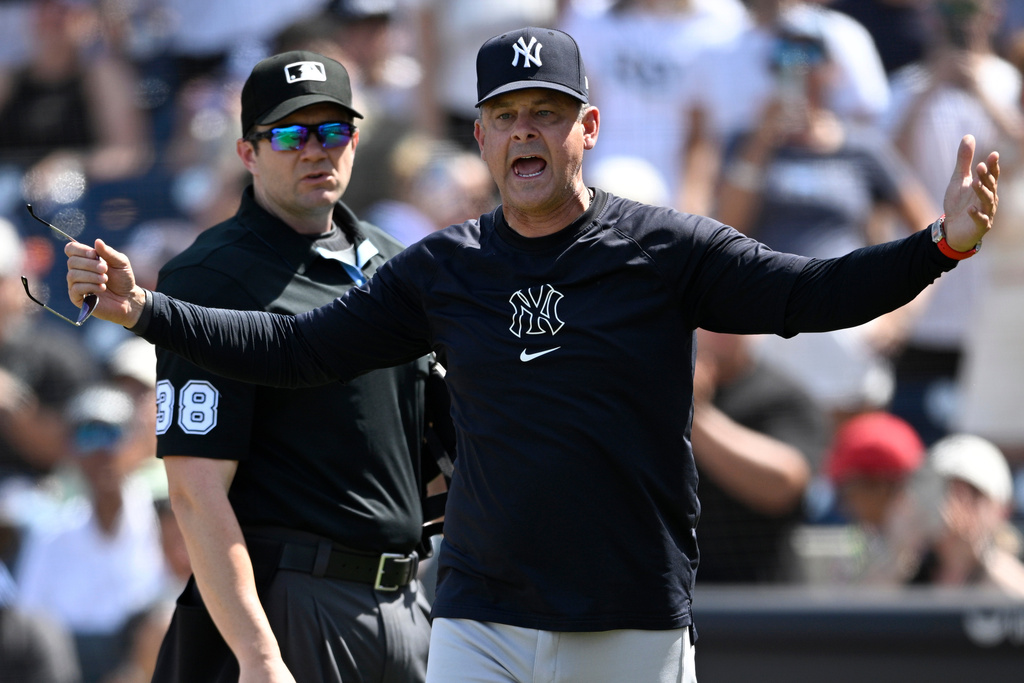 FILE - New York Yankees manager Aaron Boone, front, reacts after getting ejected by home plate umpire Adam Beck (38) during the eighth inning of a baseball game against the Tampa Bay Rays, April 20, 2025, in Tampa, Fla. (AP Photo/Phelan M. Ebenhack, File)