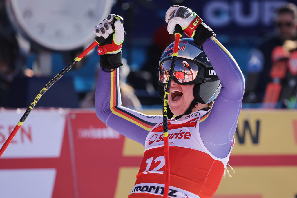 Germany's Emma Aicher reacts in the finish area after completing an alpine ski, women's World Cup downhill, in St. Moritz, Switzerland, Saturday Dec. 13, 2025. (AP Photo/Luciano Bisi)