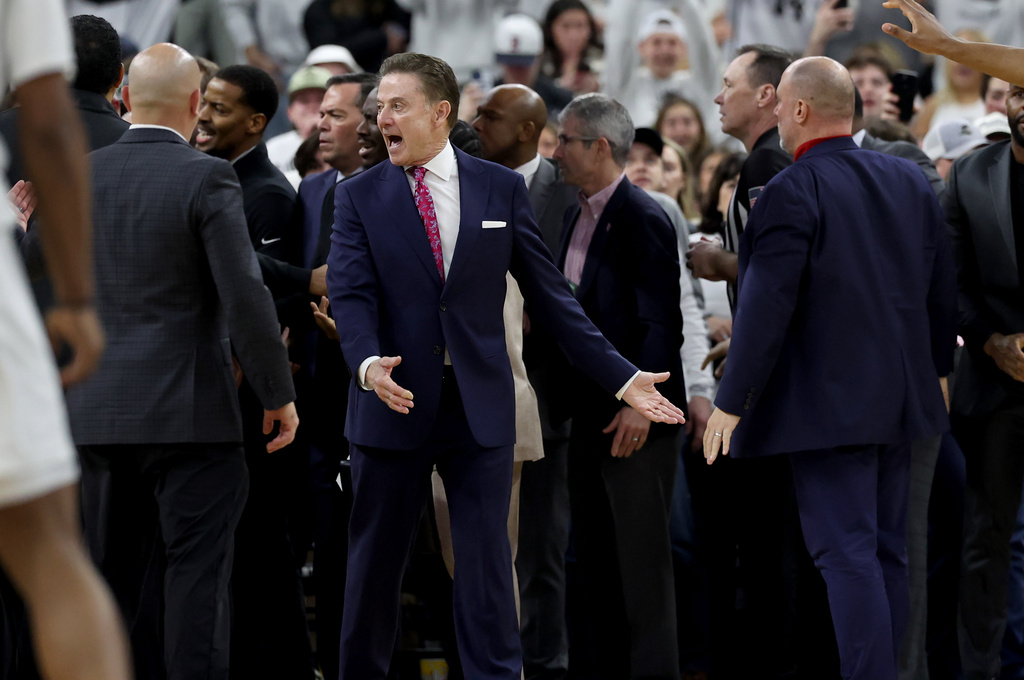 St. John's head coach Rick Pitino, center, yells after a fight broke out during the second half of an NCAA college basketball game against Providence, Saturday, Feb. 14, 2026, in Providence, R.I. (AP Photo/Mark Stockwell)