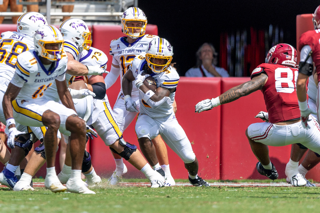 East Carolina running back Ashton Gray (3) carries the ball against Alabama during the first half of an NCAA college football game Saturday, Sept. 5, 2026, in Tuscaloosa, Ala. (AP Photo/Vasha Hunt)
